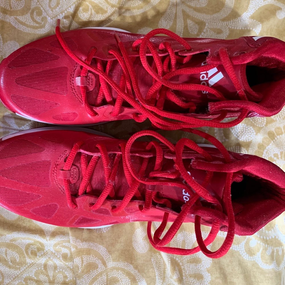 Red adidas basketball shoes